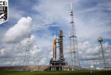 giant space launch system rocket on launch pad and cloudy sky