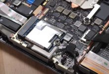 Steam Deck with rear and shield removed to expose SSD